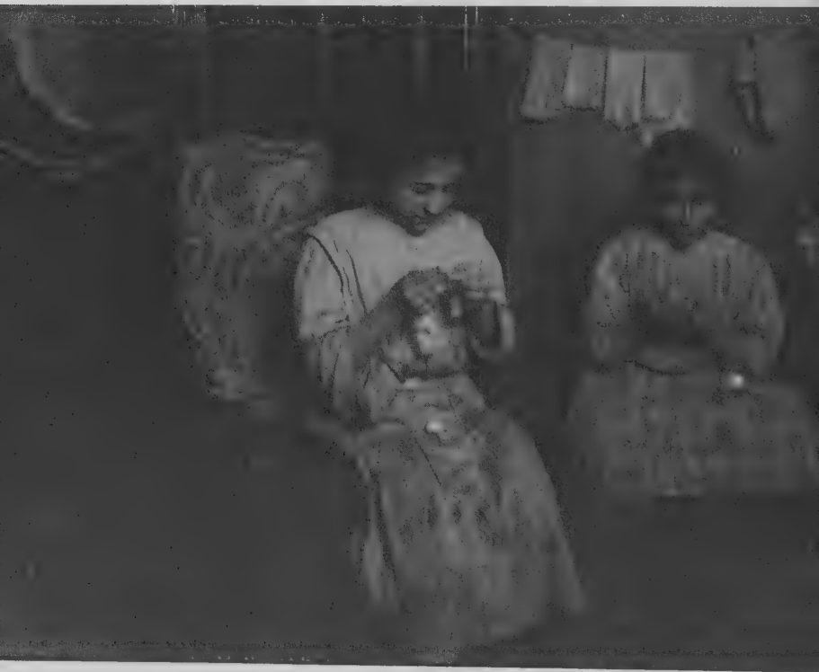 Photograph of young seamstresses working on Irish lace in New York City, 1912.